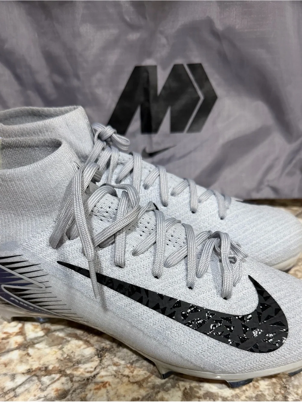 Nike Men’s Light Gray High-Top Soccer Cleats with Black Swoosh